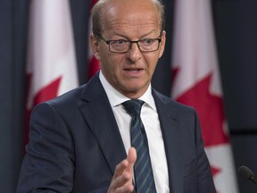 Senator Claude Carignan attends a news conference in Ottawa, Monday October 3, 2016.