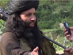 This undated image provided the SITE Intel Group, an American private terrorist threat analysis company, on Friday, Nov. 8, 2013, and authenticated based on details in it, shows Mullah Fazlullah in Pakistan. Fazlullah, the ruthless commander behind the attack on teenage activist Malala Yousafzai as well as a series of bombings and beheadings, was chosen Thursday as the leader of the Pakistani Taliban, nearly a week after a U.S. drone strike killed the previous chief.