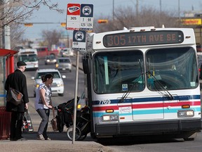 Ted Rhodes, Calgary Herald CALGARY, AB.: MARCH 11, 2012  -- Passengers board a number 305 BRT Calgary Transit bus pulls up to a stop on 17th Avenue SE Sunday afternoon March 11, 2012.