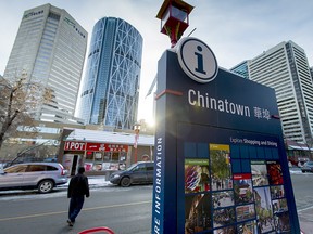 An informational sign stands in the Chinatown area of downtown Calgary.