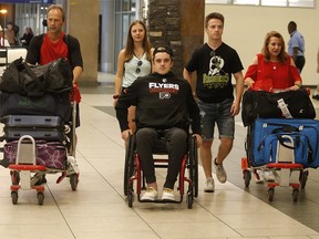 Humboldt Bronco Ryan Straschnitzki and his family arrive back in Calgary on Wednesday July 4, 2018. Leah Hennel/Postmedia