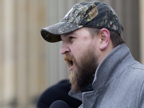 Strathmore-Brooks Independent MLA Derek Fildebrandt speaks to protesters during a pro Trans Mountain pipeline expansion rally outside the Alberta Legislature, in Edmonton Thursday April 12, 2018. Photo by David Bloom