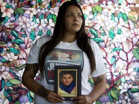 Sage Morin holds a photo of son Geo Mounsef, 2,