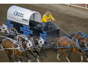 Chanse Vigen driving for dad Mike Vigen heads for the finish in Heat 9 at the Calgary Stampede Rangeland Derby on Wednesday. Photo by Mike Drew/Postmedia.