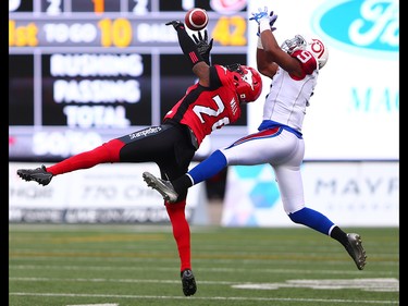 The Calgary Stampeders' Jamar Wall goes to intercept a pass meant for the Montreal Alouettes Ernest Jackson during CFL action at McMahon Stadium in Calgary on Saturday July 21, 2018.
