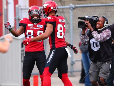 The Calgary Stampeders' Kamar Jordan, left celebrates his touchdown with Juwan Brescacin during CFL action against the Montreal Alouettes at McMahon Stadium in Calgary on Saturday July 21, 2018.