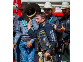 Strathmore bull rider Scott Schiffner salutes that crowd after competing in his final Calgary Stampede rodeo on Saturday, July 14, 2018, the two-time Stampede champion made his retirement official earlier in the week Al Charest/Postmedia