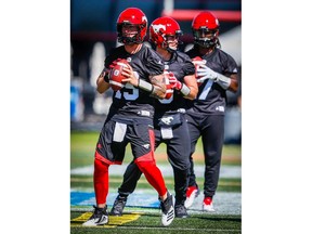 Calgary Stampeders Bo Levi Mitchell, Nick Arbuckle and Larry Brihm during practice on Monday, July 16, 2018. Al Charest/Postmedia