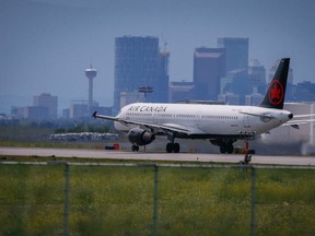 An Air Canada plane crosses over top of the airport tunnel.