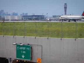 An Air Canada plane crosses over top of the airport tunnel, city of Calgary councillors signalled their support during a committee meeting on Thursday, July 19, 2018 for construction to move ahead on the second phase of the Airport Trail project. Al Charest/Postmedia