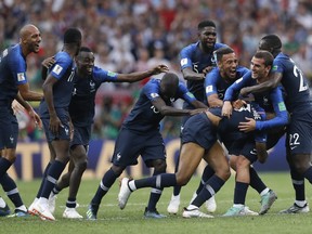 French players celebrate at the end of the final match between France and Croatia at the 2018 soccer World Cup in the Luzhniki Stadium in Moscow, Russia, Sunday, July 15, 2018. France won 4-2. (AP Photo/Petr David Josek)