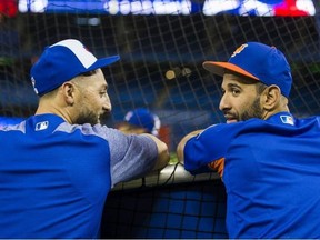 Toronto Blue Jays Kevin Pillar chats with New York Mets Jose Bautista during batting practice before the game at Rogers Centre in Toronto, Ont. on Tuesday July 3, 2018. Ernest Doroszuk/Toronto Sun