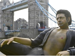 A 25ft statue of actor Jeff Goldblum's in a pose from a scene in the first Jurassic Park movie, which has been created by a TV channel to celebrate the film's 25th birthday, at Potters Fields Park, London, Wednesday July 18, 2018.