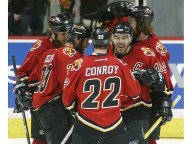 Calgary-05/19/04-Calgary Flames Jarome Iginla and Craig Conroy celebrate Martin Gelinas second period goal gainst the San Jose Sharks in NHL playoff action at the Saddledome Wednesday.  Joining the celebration are Jordan Leopold and Mike Commodore. The  Grant Black/Calgary Herald