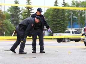Police investigate the scene of a serious assault at a strip mall in the 2000 block of 32nd avenue N.E. in Calgary on July 2, 2018.  Gavin Young/Postmedia