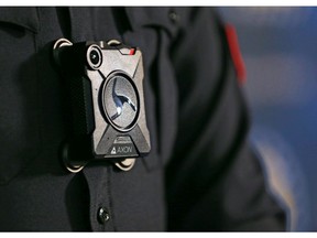 Calgary Police Service Staff Sgt. Travis Baker wears one of the service's new Axon body cameras on Tuesday July 3, 2018.  Gavin Young/Postmedia