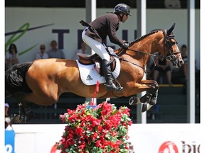 Canada's Eric Lamaze and Fine Lady 5 won the ATCO Queen Elizabeth II Cup at the Spruce Meadows North American show jumping event on Saturday July 7, 2018.  Gavin Young/Postmedia