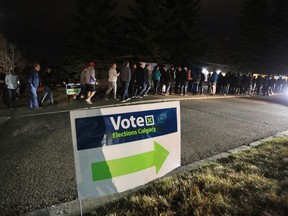 Several hundred ward 6 Calgarians remained in line outside the Strathcona Community Centre waiting to vote at 8 pm on municipal election day Monday October 16, 2017. Gavin Young/Postmedia