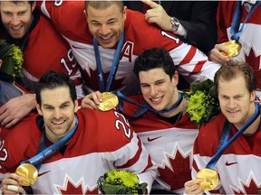 TUESDAY, MARCH 2, 2010 PAGE A1
Monday March 1, 2010 Page C4
VANCOUVER, BC: FEBRUARY 28, 2010 -- (l-R):  Team Canada's Joe Thornton, Dan Boyle, Jarome Iginla, Sidney Crosby and Chris Pronger pose for the team photo with the gold medals they were awarded after their overtime victory over the USA during the gold medal men's hockey game in Vancouver, BC Sunday, February 28, 2010 during the 2010 Winter Olympics.  (John Mahoney / Canwest News Service).   CNS-OLY-MHKY