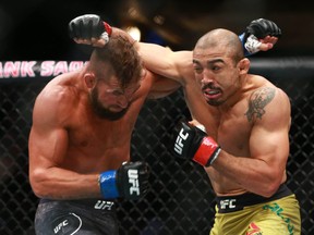 Jose Aldo, right, fights Jeremy Stephens in a featherweight bout during UFC Fight Night at the Saddledome in Calgary on Saturday, July 28, 2018  (Jim Wells/Postmedia Network)
