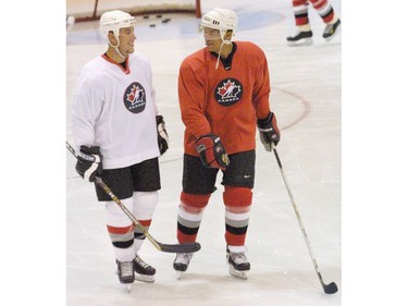 Calgary-09/05/01---L-R, Derek Morris and Jarome Iginla share a laugh during the Olympic Canadian team practice at Father David Bauer arena.   Photo by Leah Hennel/Calgary Herald DATE PUBLISHED: THURSDAY, SEPTEMBER 6, 2001 PAGE F4 * Calgary Herald Merlin Archive *