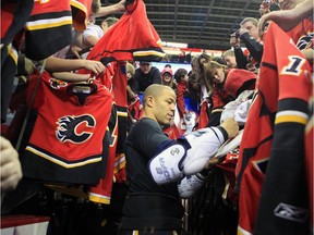 CALGARY, AB: JANUARY 03, 2010 --Jarome Iginla signs autographs for fans after the Calgary Flames annual skill competition at the Pengrowth Saddledome in Calgary on January 3, 2010. Gavin Young/Postmedia file