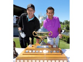 Men's Main Event teammates L-R, Kevin Temple and Jamie Welder check out the trophy before teeing up at the 44th Annual Riley's Finals at Canyon Meadows Golf Club in Calgary on Sunday July 8, 2018. Darren Makowichuk/Postmedia