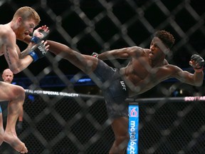Hakeem Dawodu, right, fights Austin Arnett during UFC Fight Night at the Saddledome in Calgary on Saturday, July 28, 2018 in a preliminary match. Dawodu won by unanimous decision. (Jim Wells/Postmedia Network)