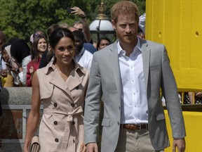 Britain's Prince Harry, Duke of Sussex and Meghan, Duchess of Sussex arrive for a visit to the Nelson Mandela Centenary Exhibition, which explores the life and times of Nelson Mandela and marks the centenary of his birth, at Southbank Centre's Queen Elizabeth Hall in south London on July 17, 2018. / AFP PHOTO / Arthur EdwardsARTHUR EDWARDS/AFP/Getty Images