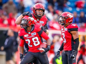 Calgary Stampeders Brandon Smith celebrates after his interception against Jeremiah Masoli of the Hamilton Tiger-Cats during CFL football in Calgary on Saturday, June 16, 2018. Al Charest/Postmedia