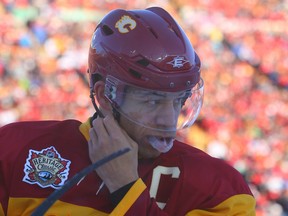 Jarome Iginla of the Calgary Flames gets ready for a face off against the Montreal Canadiens during the 2011 NHL's Heritage Classic outdoor hockey game at McMahon Stadium  in Calgary, Alberta, Sunday February 20, 2011. JIM WELLS/CALGARY SUN/QMI AGENCY