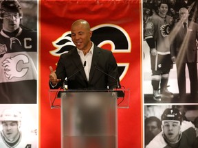 NHL great Jarome Iginla and family retires a Calgary Flames at the Scotiabank Saddledome in Calgary on Monday  (Darren Makowichuk/Postmedia)