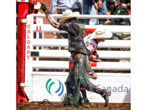 J.B. Mauney from Statesville, N.C., during bull riding at the Calgary Stampede in Calgary, on Tuesday July 10, 2018. Leah Hennel/Postmedia