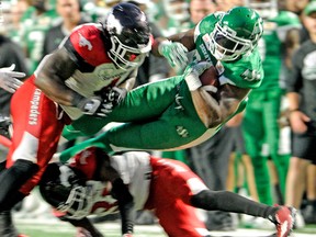 Saskatchewan Roughriders running back Jerome Messam is taken down during second half CFL action at Mosaic Stadium in Regina on Friday, July 28, 2018.