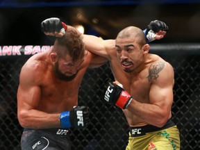 Jose Aldo, right, fights Jeremy Stephens in a featherweight bout during UFC Fight Night at the Saddledome in Calgary on Saturday, July 28, 2018. (Jim Wells/Postmedia Network)