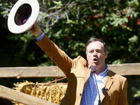 UCP Leader Jason Kenney talks to supporters during the UCP Stampede BBQ at James Short Park in Calgary on Sunday July 8, 2018. Darren Makowichuk/Postmedia
