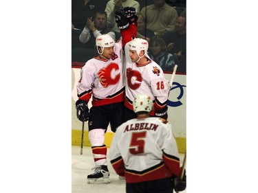 Calgary-01/21/01-Calgary Flames right winger Jarome Iginla and left winger Cary Stillman raise their arms in celebration following the Flames fourth goal scored by Iginla during the sedond period of last nights game against the Detroit Red Wings at the Saddledome. Photo by Colleen Kidd/Calgary Herald  HOCKEY; GAME ACTION DATE PUBLISHED: THURSDAY, MARCH 8, 2001 PAGE C3 *Calgary Herald Merlin Archive*