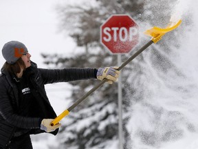 Darin Baer was busy shovelling snow in Calgary on March 3, 2018. (Darren Makowichuk/Postmedia)