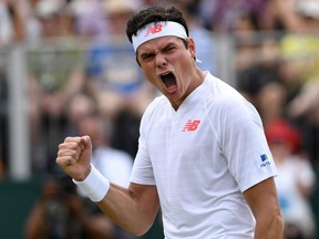 Canada's Milos Raonic celebrates after defeating U.S. player Mackenzie McDonald in their fourth round match during Wimbledon at The All England Lawn Tennis Club in London on Monday, July 9, 2018.