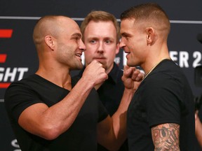 Eddie Alvarez, left, and  Dustin Poirier strike a pose during UFC Fight Night media day at the Hyatt Regency on July 26, 2018. The two fighters will meet on Saturday night.