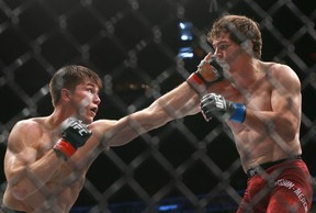 Alexander Hernandez, left, fights Olivier Aubin-Mercier in a lightweight bout during UFC Fight Night at the Saddledome in Calgary on Saturday, July 28, 2018 (Jim Wells/Postmedia Network)