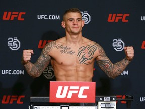 Dustin Poirier weighs in at the Hyatt Regency in Calgary on Friday.