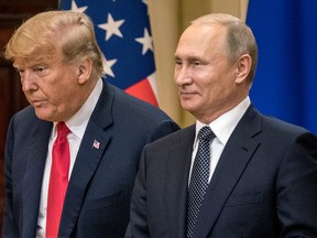 HELSINKI, FINLAND - JULY 16:  U.S. President Donald Trump (L) and Russian President Vladimir Putin arrive to waiting media during a joint press conference after their summit on July 16, 2018 in Helsinki, Finland. The two leaders met one-on-one and discussed a range of issues including the 2016 U.S Election collusion.  (Photo by Chris McGrath/Getty Images)