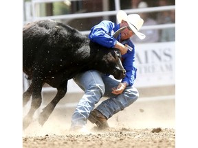 Jon Ragatz from Beetown, WI, during the Steer Wrestling event on day 6 of the 2018 Calgary Stampede rodeo in Calgary on Wednesday July 11, 2018. Darren Makowichuk/Postmedia