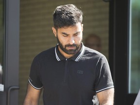 Truck driver Jaskirat Sidhu walks out of provincial court after appearing for charges due to the Humboldt Broncos bus crash in Melfort, Sask., on Tuesday, July 10, 2018. THE CANADIAN PRESS/Kayle Neis ORG XMIT: KAN105