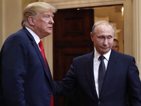 U.S. President Donald Trump, left, and Russian President Vladimir Putin leave a press conference after their meeting at the Presidential Palace in Helsinki, Finland, on Monday, July 16, 2018. Pablo Martinez Monsivais