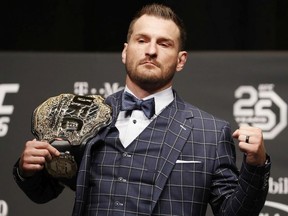 Stipe Miocic poses during a news conference for UFC 226, Thursday, July 5, 2018, in Las Vegas. Miocic is scheduled to fight Daniel Cormier in a heavyweight title fight Saturday in Las Vegas.