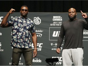 Francis Ngannou, left, and Derrick Lewis pose during a news conference for UFC 226, Thursday, July 5, 2018, in Las Vegas. The two are scheduled to fight in a heavyweight mixed martial arts bout Saturday in Las Vegas.