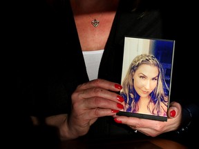 Trena Patterson holds a photo of her daughter, Jessica Patterson, who was killed in a police shooting on Nov. 29, 2016 in Calgary.