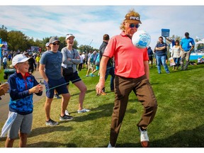 PGA golfer Miguel Ángel Jiménez shows off his soccer skills while signing autographs after shooting a 6-under 64 on Day 1 of the Shaw Charity Classic at Canyon Meadows Golf Club on Friday. Photo by Al Charest/Postmedia.